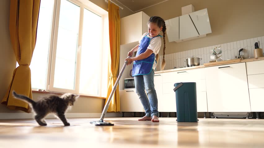 Smart House. Girl helps her mother clean room. Girl washes floor. Wet room cleaning. Young mother's helper. Child learns to be clean. Caring for cleanliness of house. Daily lifestyle of people. | Shutterstock HD Video #1101151103