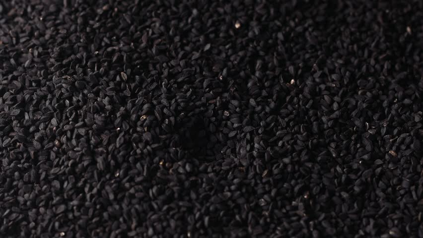 Black cumin seeds are taken with a spoon Royalty-Free Stock Footage #1101153935