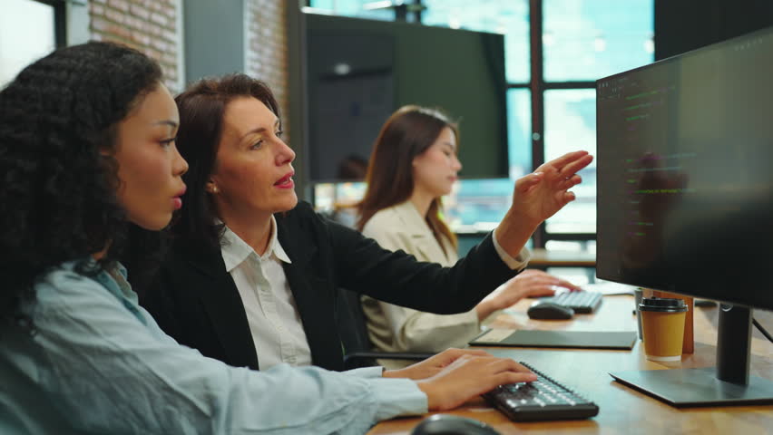 Female programmer is hard at work in her office, diligently coding her project while collaborating with her team. Coding, Programmer, Data, Technology, Development, Online and Science concept. - Powered by Shutterstock - Get 15% off with code: PIKWIZARD15