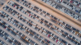 The drone could capture wide shots of the parking lot, showing rows upon rows of cars in different colors and models. This footage could be used to provide context for a variety of different videos
