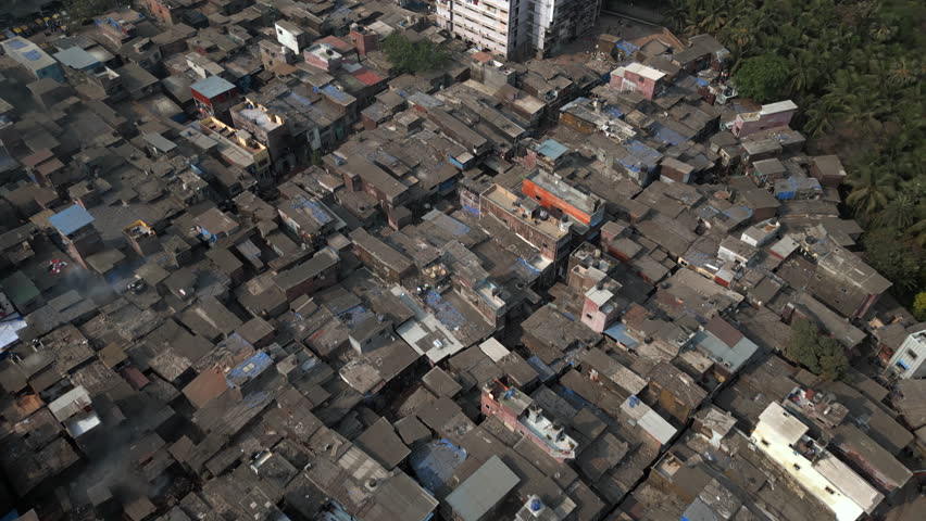 Aerial view flying over the Dharavi slums in Mumbai, Maharashtra, India. Dharavi is considered to be one of the largest slums in the world and the largest in Asia.