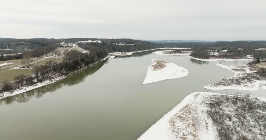 Gray panorama of unfrozen Beaver Lake during mild winter. Drone footage. 