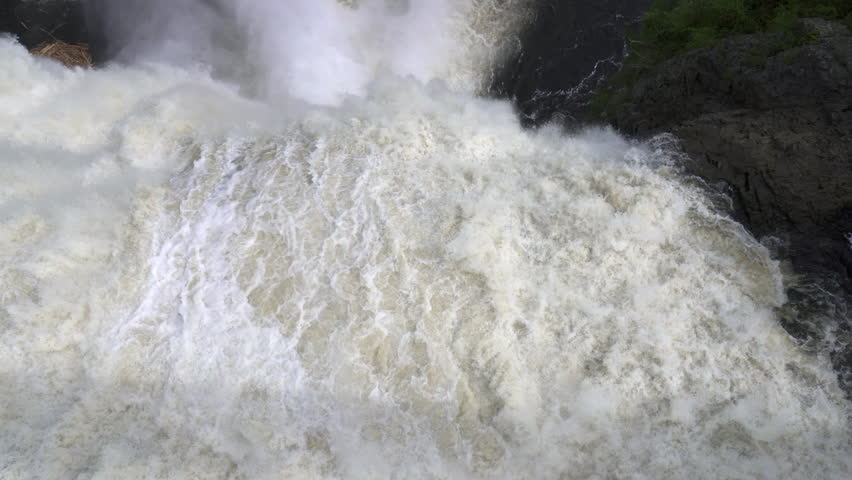 The Montmorency Falls (Chute Montmorency) large waterfall on Montmorency River where it drops into the Saint Lawrence River in Quebec, Canada. Protected within Montmorency Falls Park.