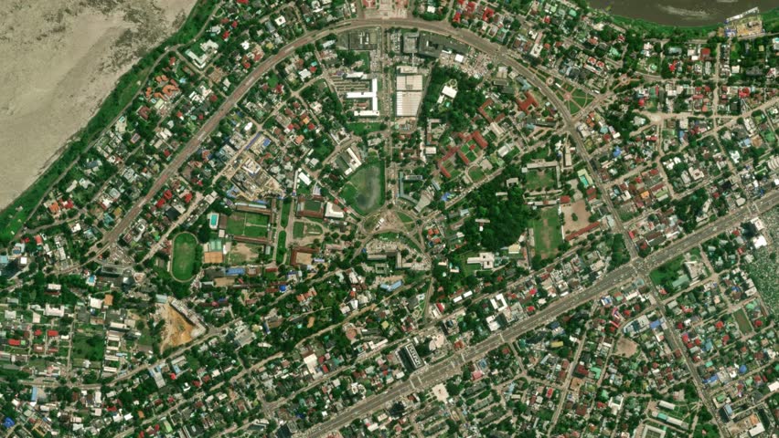 Earth zoom in from space to Kinshasa, Congo in Place De L'Independance. Followed by zoom out through clouds and atmosphere into space. Satellite view. Travel intro