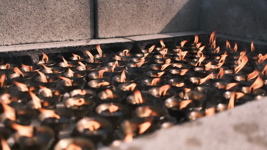 Candles Burning In Buddhist Temple