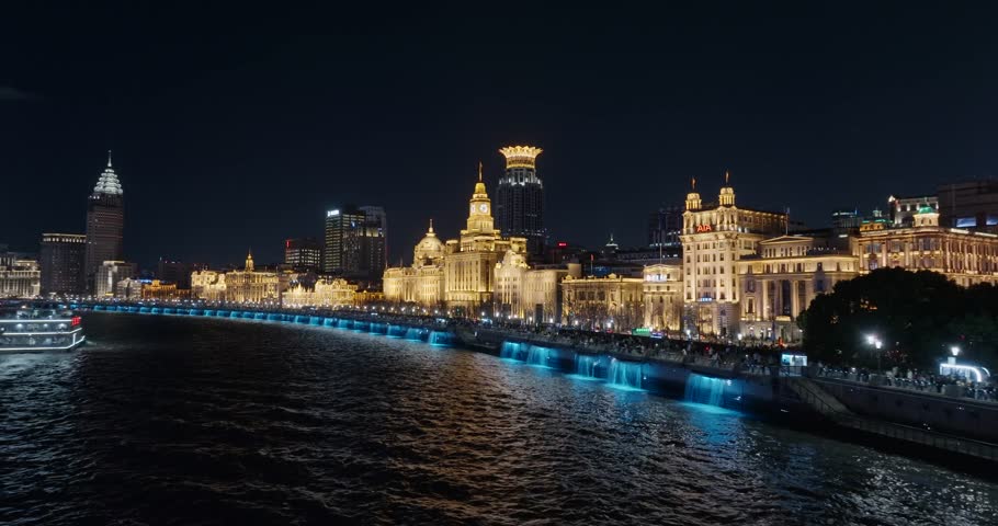 Aerial view of The bund in Shanghai at night.Exotic building clusters in the Bund of Shanghai，Tourists enjoy the view of the city from the sightseeing platform.