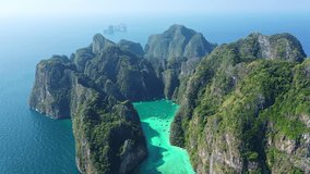 Aerial view of Koh Phi Phi   
island and the blue-green waters of Thailand with many tourist boats.