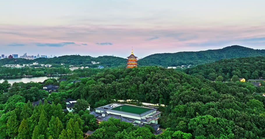 Aerial view of the beautiful West Lake natural scenery at sunset in Hangzhou, China. Ancient Leifeng Pagoda and with mountain scenery in Hangzhou. Famous travel destinations in China.