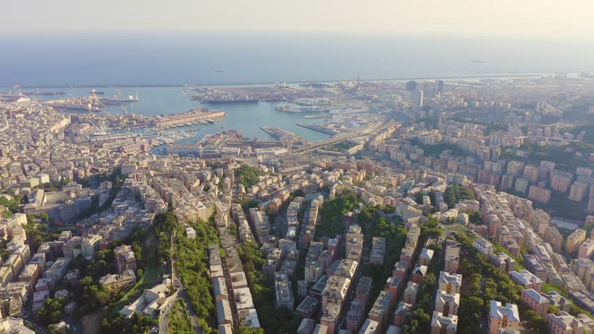 Inscription on video. Genoa, Italy. Central part of the city, aerial view. Ships in the port. Glitch effect text, Aerial View