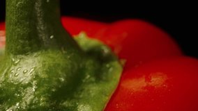 Isolated Red Bell pepper on a black background. Rotation. Dolly slider extreme close-up. - Powered by Shutterstock - Get 15% off with code: PIKWIZARD15