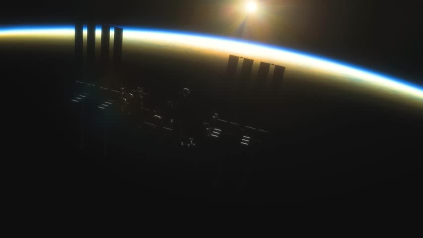 International Space Station ISS Floating in Orbit above Planet Earth in outer space. Sunrise or sunset view from space | Shutterstock HD Video #1101188689