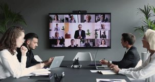 Global, worldwide, communication using video conference application. Group of diverse, multi ethnic businesspeople participate in virtual meeting event, share strategy, make business use modern tech