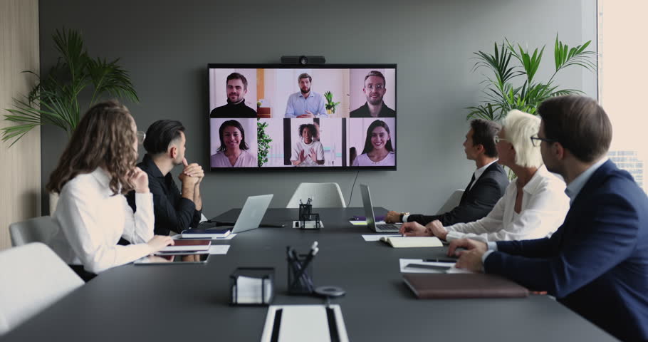 Diverse businesspeople take part in video conference call use application. Executives and group of multi-ethnic entrepreneurs, managers or investors engaged in virtual meeting. Modern tech, business