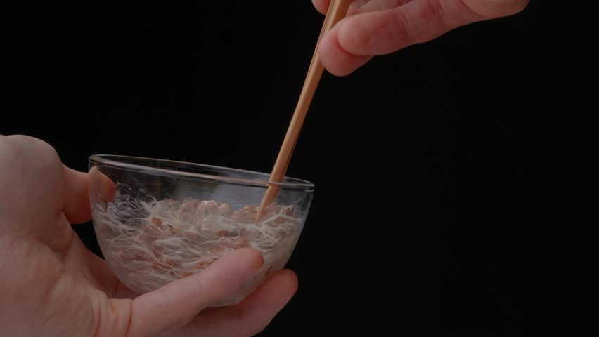 4K slow motion video to check the stickiness of natto (fermented soybeans) Royalty-Free Stock Footage #1101194719