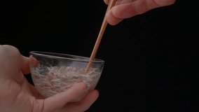 4K slow motion video to check the stickiness of natto (fermented soybeans)