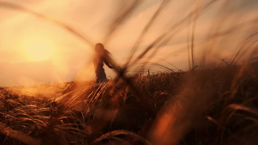 Beauty Girl Outdoors enjoying nature. Beautiful Teenage Model girl in white dress running on the Spring Field, Sun Light.