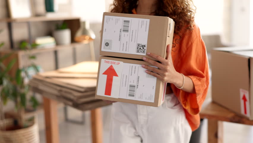 Box, ecommerce and black woman small business owner packing orders for shipping and delivery in her office, happy and cheerful. Startup, retail and store worker prepare package, parcel and boxes Royalty-Free Stock Footage #1101210013