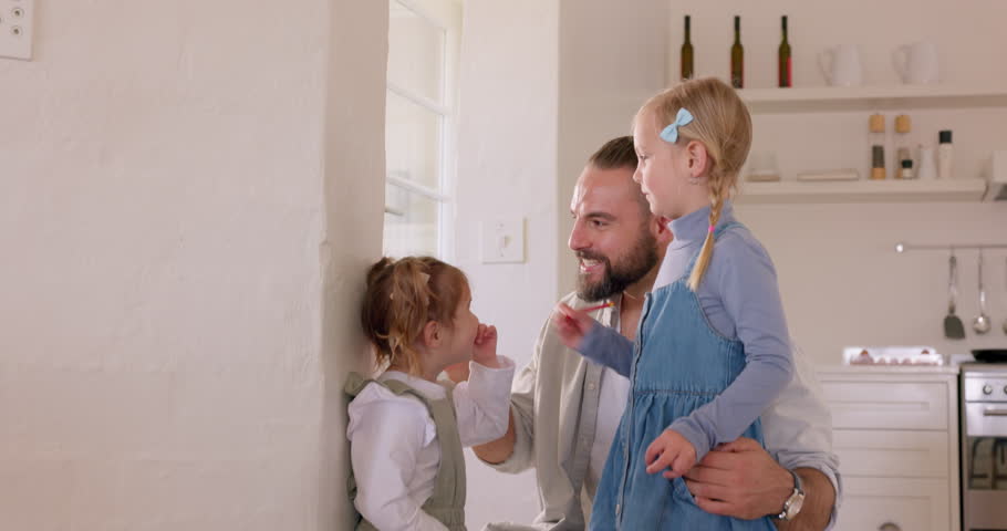 Children check height growth with father on the wall in the house for healthy development progress as young girls or kids. Smile, family and happy school students mark growing measurement at home Royalty-Free Stock Footage #1101210525