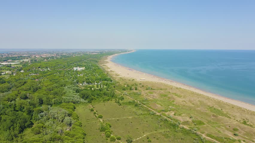 Inscription on video. Venice, Italy. Beaches of Punta Sabbioni. Cavallino-Treporti. Clear sunny weather. Lightning strikes the letters, Aerial View