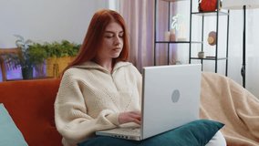 Tired freelancer redhead woman use laptop, suffering from headache problem tension and migraine, stress at home room. Girl works on notebook, sends messages, makes online purchases, watching movies - Powered by Shutterstock - Get 15% off with code: PIKWIZARD15