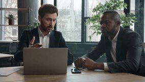 African American businessman listen Caucasian man trader agent check data in documents papers in bank office. Two diverse multiracial businessmen with laptop online project startup business discussion - Powered by Shutterstock - Get 15% off with code: PIKWIZARD15