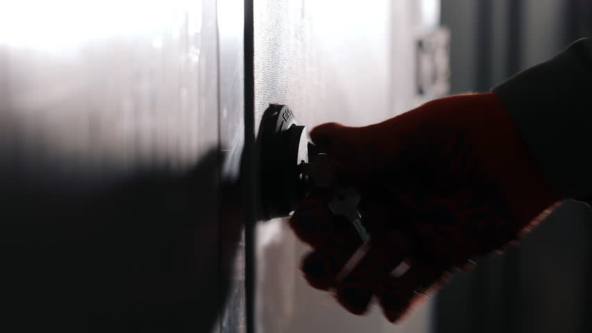 Close-up of opening the door with a key to service the ventilation filters.