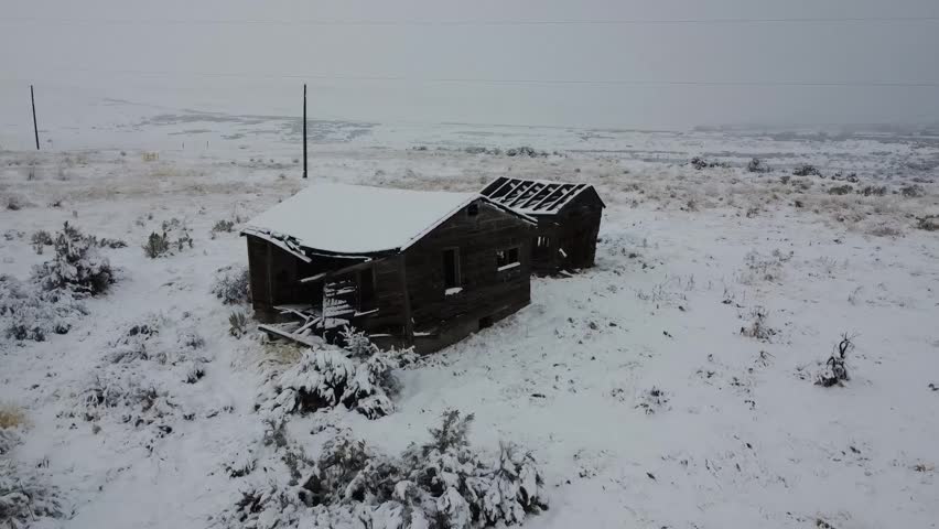 Drone View Of Abandoned Rustic Building In The Snow
