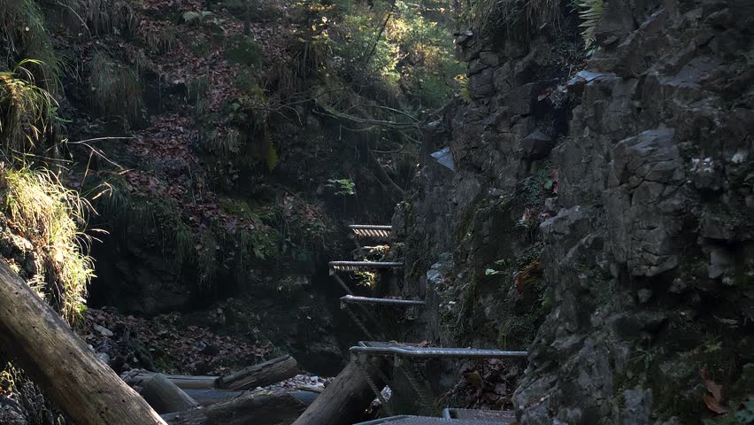 Excursionist Walks On Iron Stairs In Slovak Paradise National Par. Handheld Shot