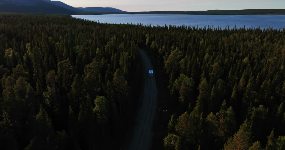 Camper driving towards the Pallastunturi fells, summer in Lapland - Aerial view | Shutterstock HD Video #1101229437