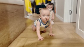 little baby child masters crawling. happy family kid dream concept child baby crawling around the house. the baby enjoys the movement. baby crawling on the floor indoor lifestyle