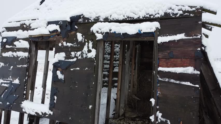 Drone View Of Old Abandoned Rustic Building In The Snow