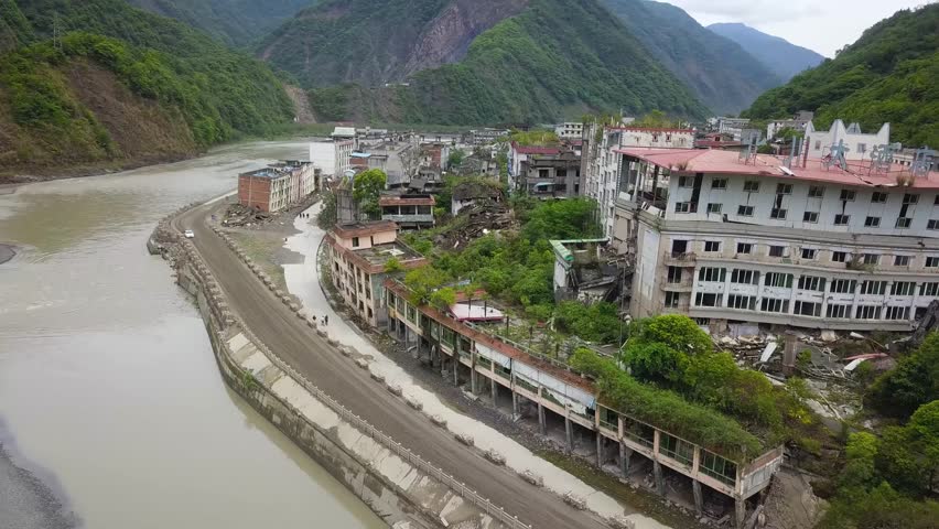 Aerial shot of a ruined area along a river Lidung County, Sichuan Province, China, after the earthquake.