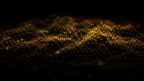 Defocused particles background golden. Abstract golden surface and defocused glowing particles in slow motion. 4k seamless loop