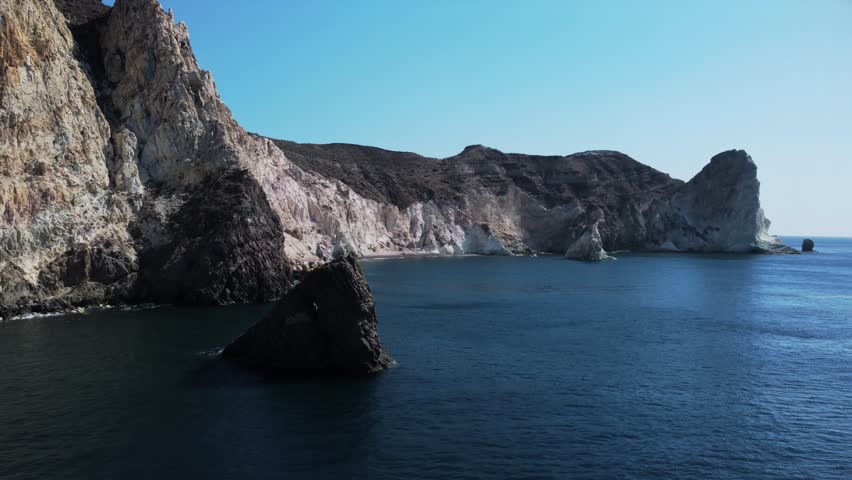 Aerial view above a rock mountain, White beach, Santorini Island. Geology concept