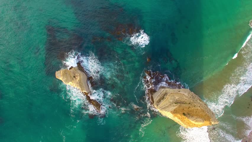 The Twelve Apostles along Great Ocean Road in Victoria, Australia. Port Campbell National Park on a beautiful sunrise, aerial view. Slow motion.