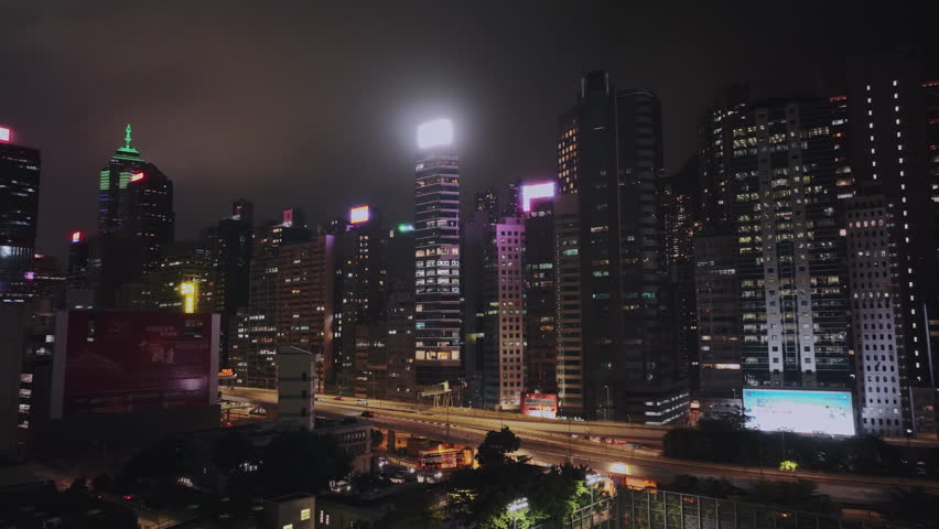 Night Highway And Bright Buildings Of Hong Kong, Aerial View