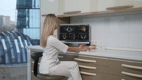 girl dentist looks at the monitor, and then turns and looks at the camera - Powered by Shutterstock - Get 15% off with code: PIKWIZARD15