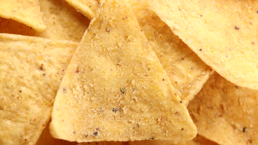 Corn chips, rotation in circle. Traditional mexican food, Nachos Macro. | Shutterstock HD Video #1101245115