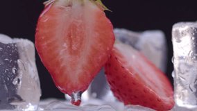 Water pours over strawberries and drips on a light black background. Natural vitamin product for fresh or natural juice. Slow motion, 8K downscale, 4K. - Powered by Shutterstock - Get 15% off with code: PIKWIZARD15