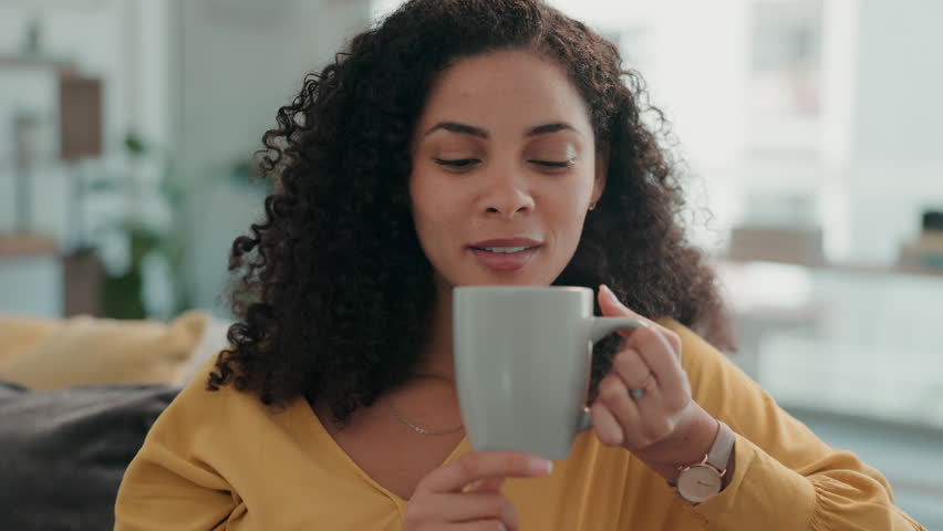 Relax, coffee and woman thinking, peace and calm in living room, resting and happiness. Female, tea and lady in lounge, wellness and smile with cappuccino, latte and happy with joy and mindfulness | Shutterstock HD Video #1101254963