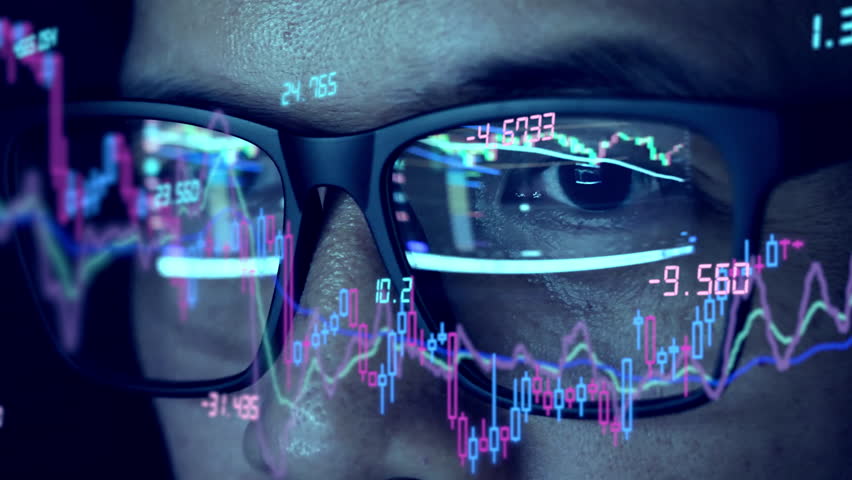 Close-up camera to trader's glasses analyzing stock charts Royalty-Free Stock Footage #1101255989