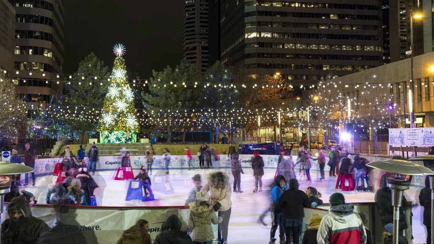 Denver , Colorado , United States - 12 29 2022: Time lapse of people using the Southwest Downtown Denver Rink during the winter.