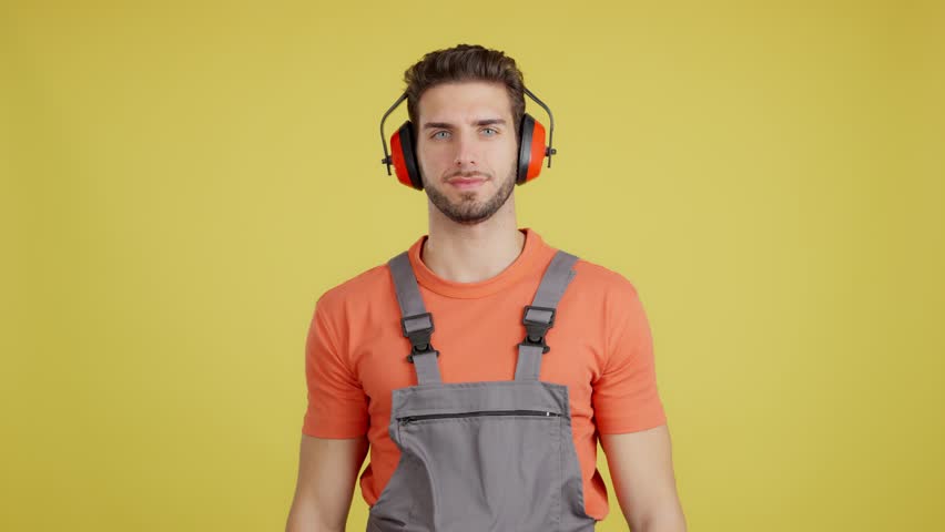 Friendly caucasian man carpentry worker in work uniform