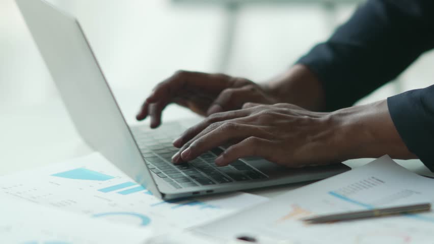 Businessman hand pressing on the laptop keyboard, World of technology and internet communication concept.
