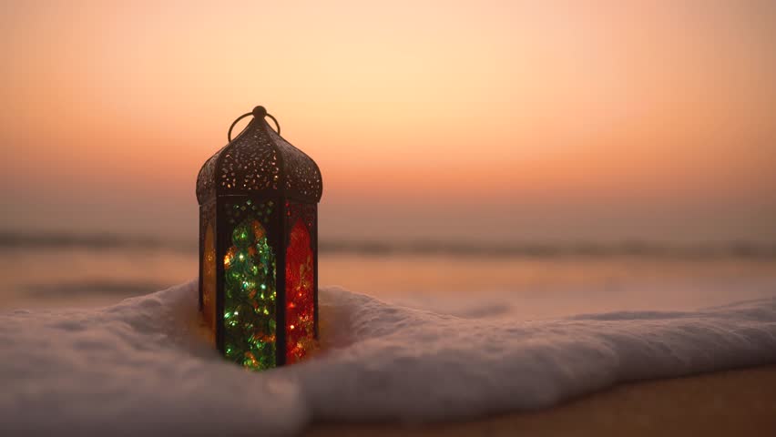 Traditional Ramadan Lantern Lamp on the beach during sunset, Ramadan and Eid Greetings Video with Copy space, 2023 Islamic concept video | Shutterstock HD Video #1101260909
