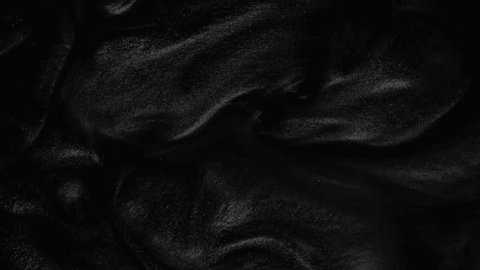 Liquid dark motion organic background. Shine glitter fluid metallic black color paint. Texture abstract acrylic cloud swirling underwater. Video stock