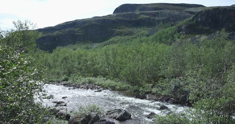 Landscape view of Siilaskoski rapids with fell Pikku-Malla behind in summer, Kilpisjärvi, Lapland, Finland.