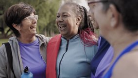 Multiracial sport senior women having fun together after exercise workout outdoor at city park - Powered by Shutterstock - Get 15% off with code: PIKWIZARD15