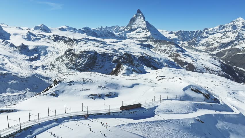 Zermatt, Switzerland -The train of Gonergratbahn running to the Gornergrat station and observatory  in the famous touristic place with clear view to Matterhorn.