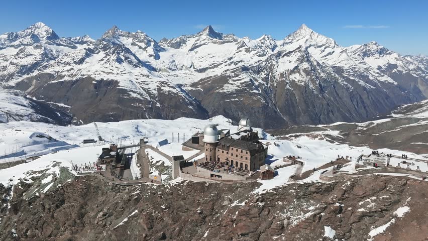 Aerial panorama view of the luxury hotel and the astronomic observatory at the Gornergrat, in the background of the Matterhorn or Cervino mount, Zermatt, Valais, Switzerland, Europe